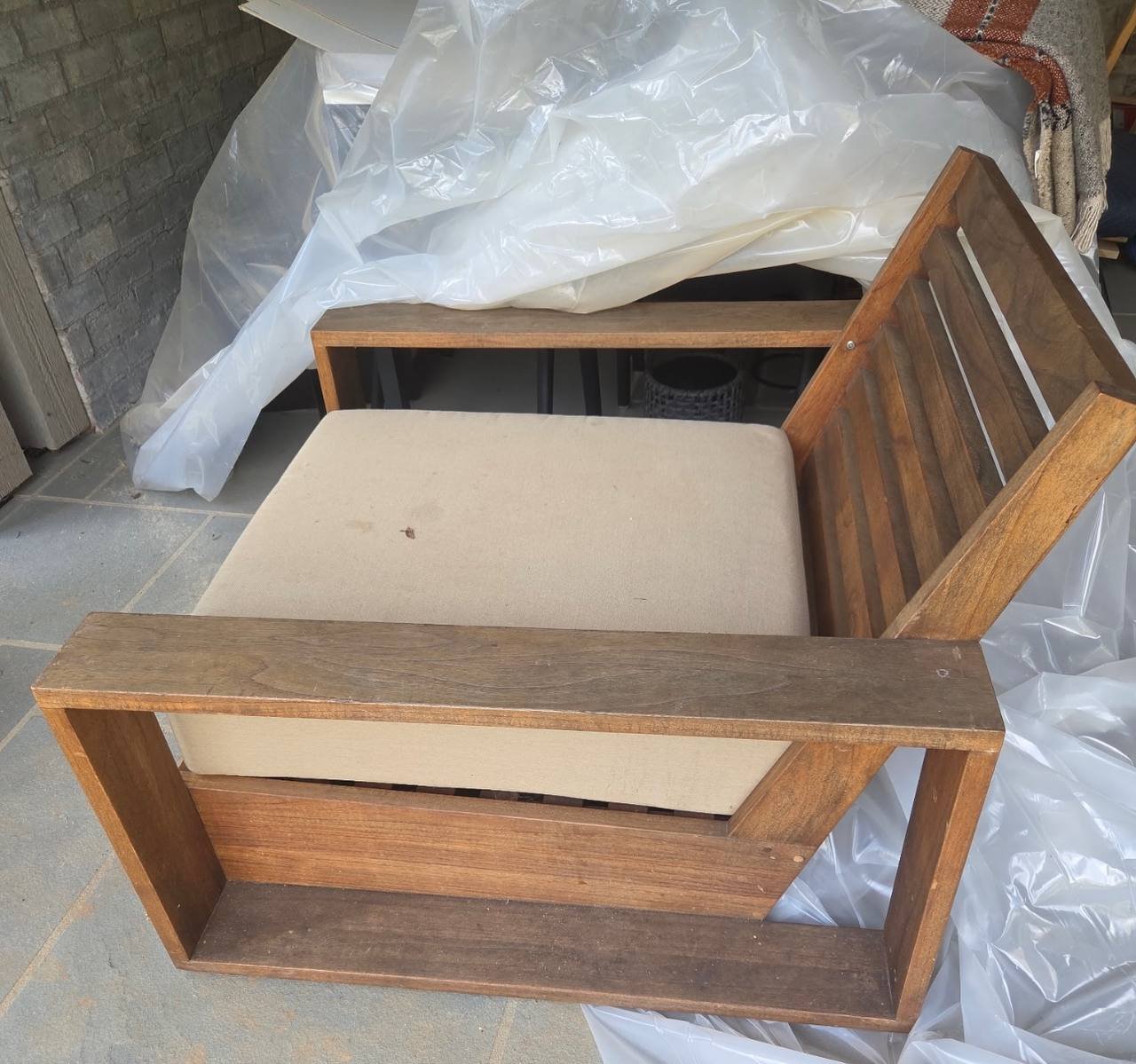 Teak outdoor chair before seasonal cleaning and restoration